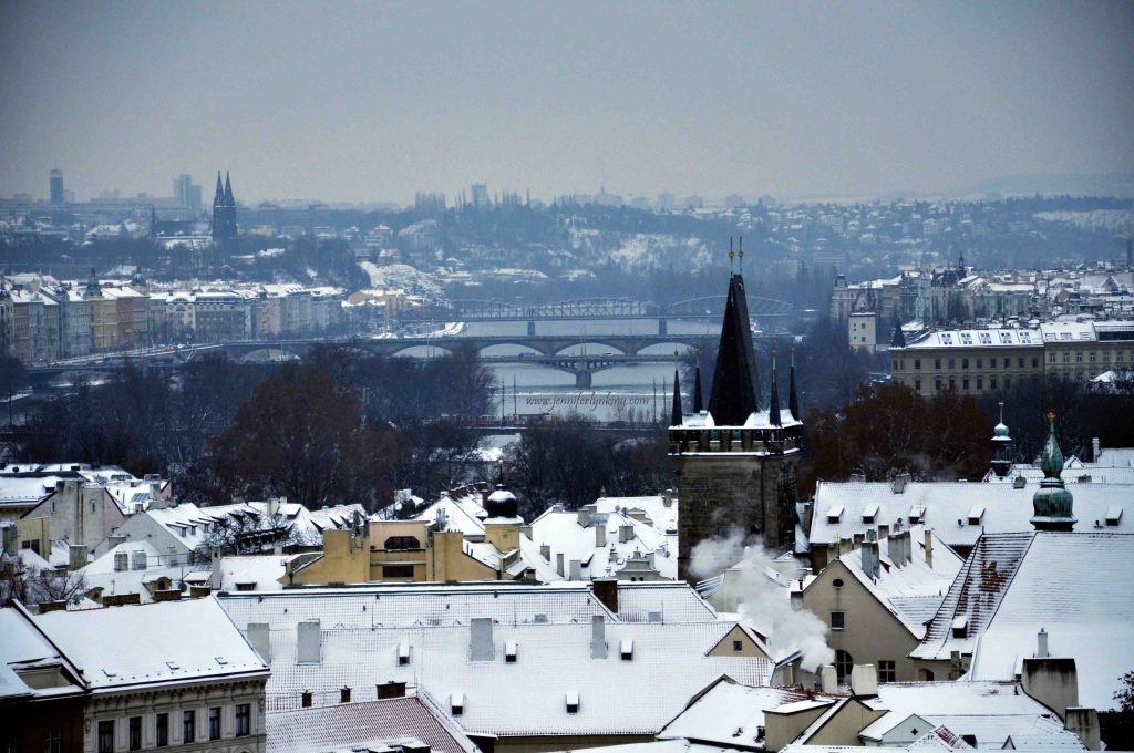 Prague's Spires and Bridges with Snow in Winter