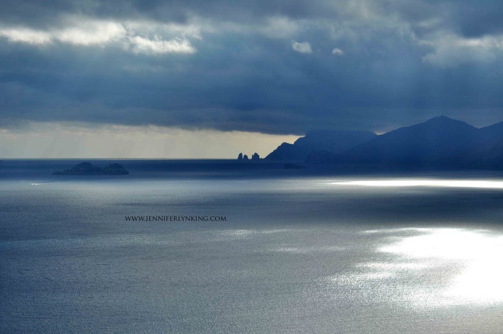 Dark Seas across the view from Praiano to the Faraglioni and Isle of Capri, Italy